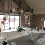 Beckett's Farm - A single-line Arch and 3-balloon Clusters in chocolate, mocha and ivory. Beckett's Farm - A single-line Arch and 3-balloon Clusters in chocolate, mocha and ivory.