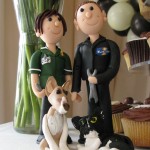 Calderfields- Another 'Happy Couple' Bride and Groom pose by the cake table, this time made in miniature.
