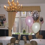 Hillscourt Conference Centre. 3-balloon Clusters in the stunning combination of pearl ivory, pearl pink and chocolate inside a 'Just Married Around' clear balloon.