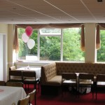 3-balloon Clusters in white, pearl pink and pearl rose at the Our Lady of Lourdes Centre. Balloons by Huff, Puff and Away!