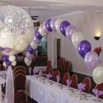 Wedding Decor at the Old Rose and Crown. An arch in ivory, spring lilac and quartz purple, with a 'Studley Bubble' in the foreground filled with balloons in the same colours Wedding Decor at the Old Rose and Crown. An arch in ivory, spring lilac and quartz purple, with a 'Studley Bubble' in the foreground filled with balloons in the same colours