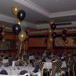 5-balloon Clusters in gold and black, the gold balloons being printed with 2 different designs. The Queen Hotel, Chester, balloon decor by Huff, Puff and Away! 5-balloon Clusters in gold and black, the gold balloons being printed with 2 different designs. The Queen Hotel, Chester, balloon decor by Huff, Puff and Away!