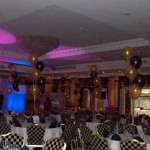 5-balloon Clusters in gold and black, the gold balloons being printed with 2 different designs. The Queen Hotel, Chester, balloon decor by Huff, Puff and Away! 5-balloon Clusters in gold and black, the gold balloons being printed with 2 different designs. The Queen Hotel, Chester, balloon decor by Huff, Puff and Away!
