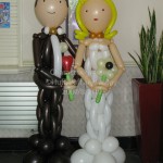 Balloon Bride and brown-suited Groom by Huff, Puff and Away!